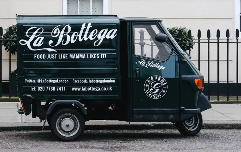 La Bottega Black Auto Wrapped in Beautiful Vehicle Decals
